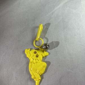 Vintage 1980s Plastic Bell Charm Yellow clown Googly Eyes Clip-on Toy